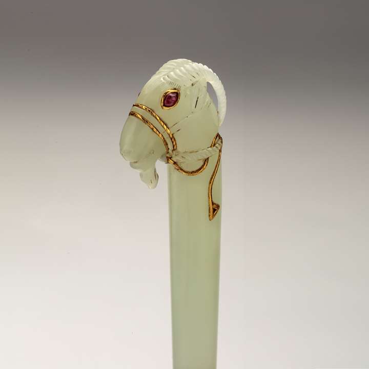 A small jade dagger with head of an ibex
